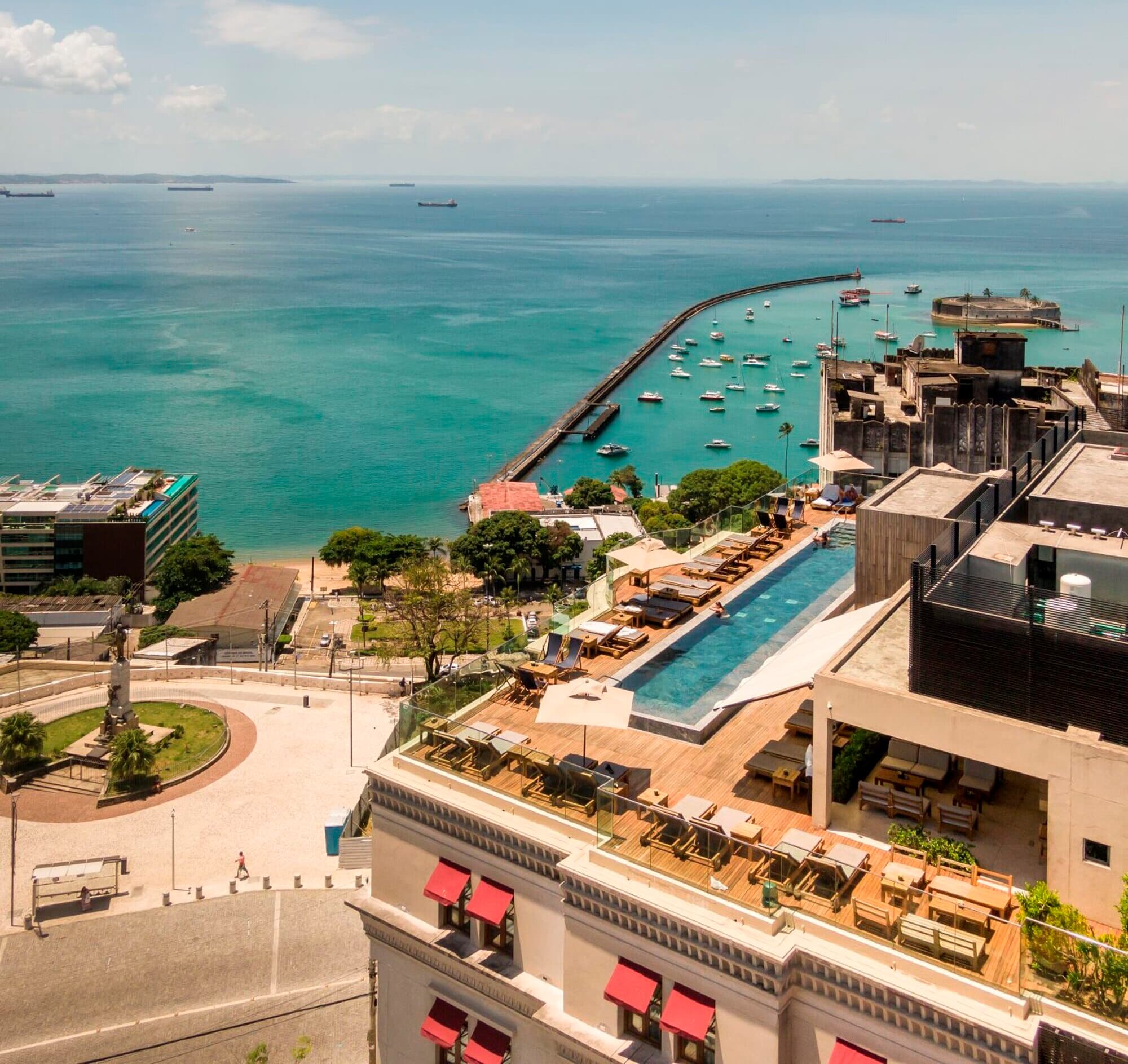 Aerial view of Hotel Fasano Salvador's rooftop pool and the Bay of All Saints, Salvador, Bahia