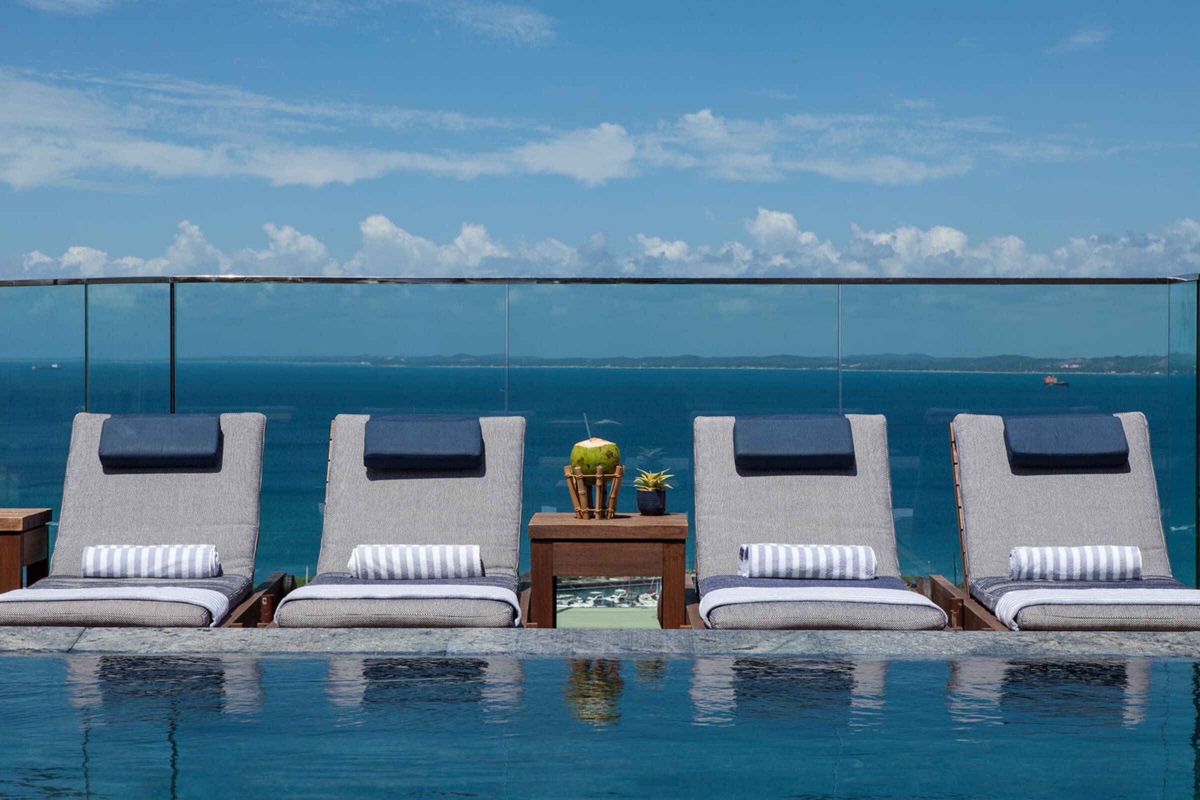Fasano Salvador rooftop — infinity pool loungers overlooking the Atlantic