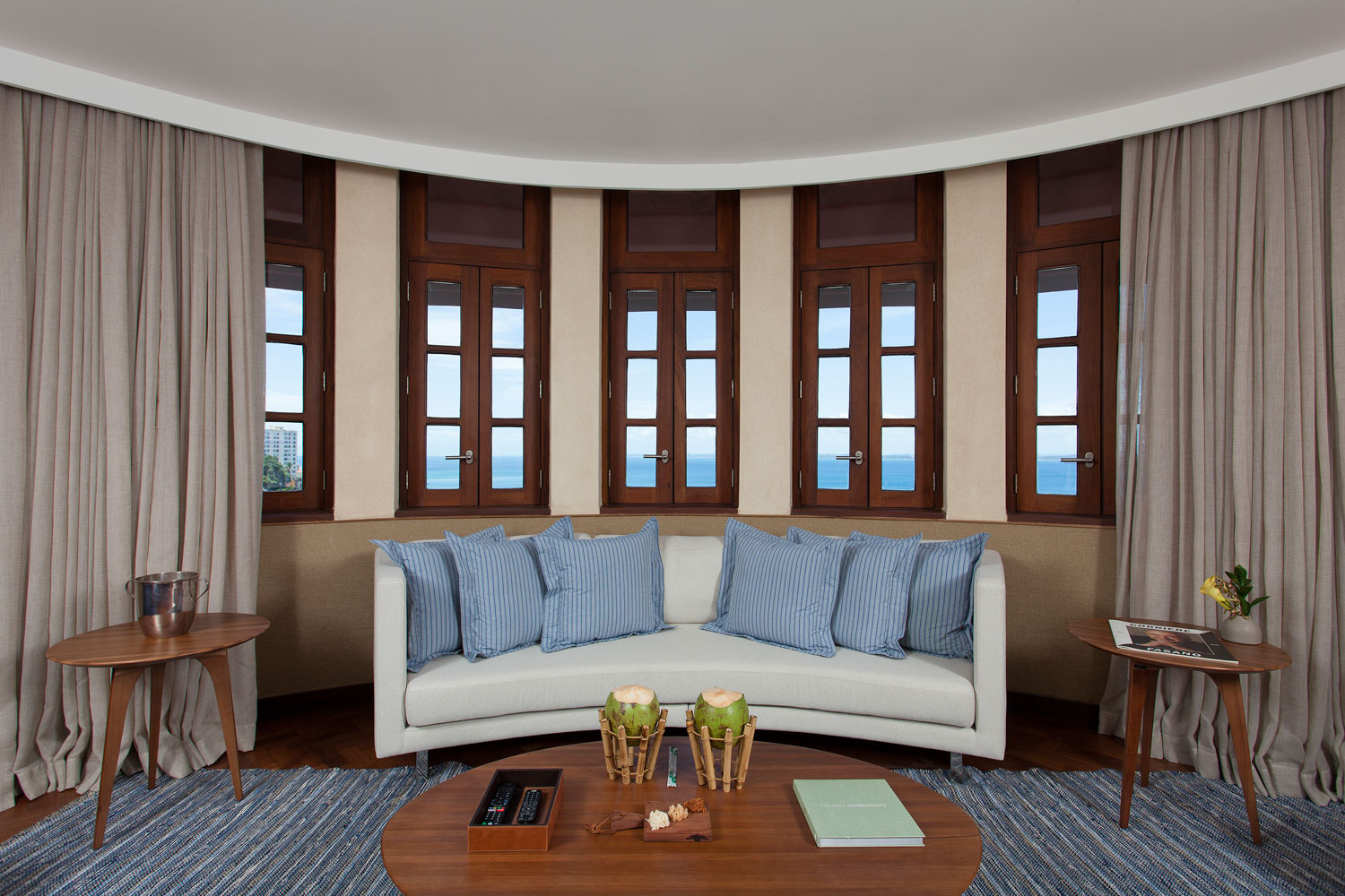 Fasano Salvador suite — curved bay window with ocean views